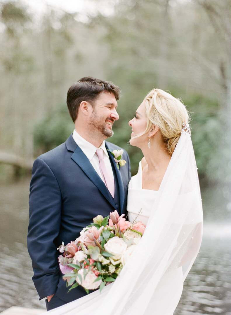 Bride and Groom Smiling at Each Other at Old Edwards Inn in Highlands North Carolina