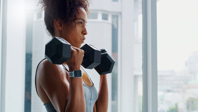 Woman using dumbbells during her workout