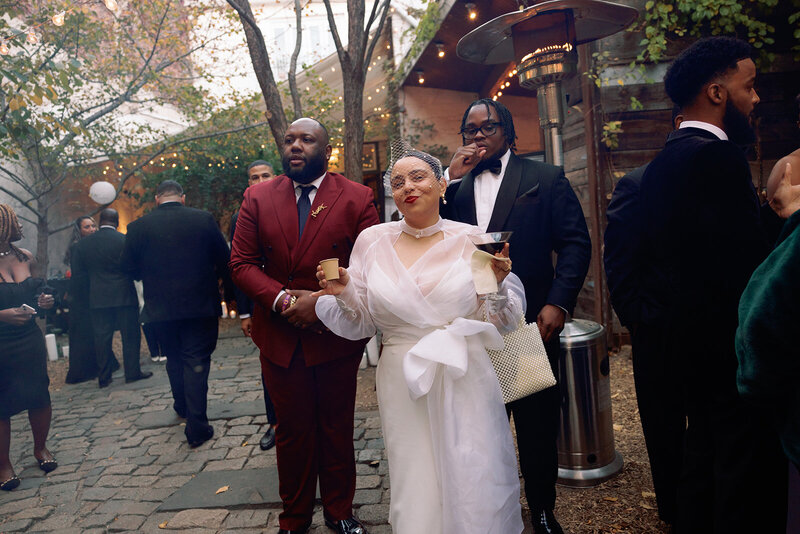 bride with wedding guests at her city wedding 
