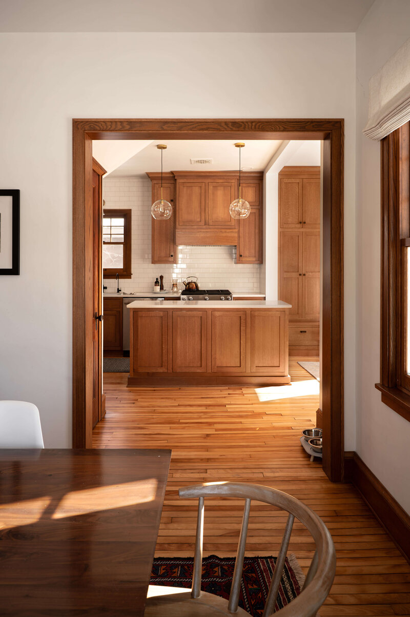modern dining room and kitchen with hardwood floors