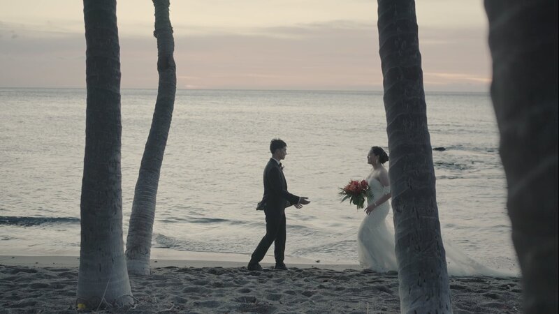 The bridal party is dancing with their flowers and all pointing out second floor balcony for grand entrance of bride and groom  by  Jimmy Shin Film based in Los angeles wedding videography