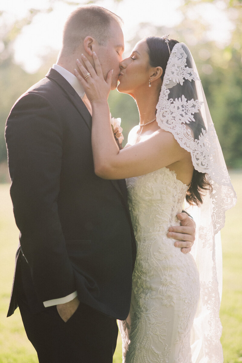 Bride and groom share a kiss at the sunset at the Ryland Inn a premiere NJ Wedding Venue captured by NJ Wedding Photographers | Michelle Behre Photography