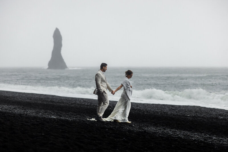 Beautiful couple eloping at the black sand beach in Iceland