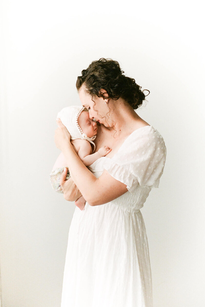 mom holding newborn baby