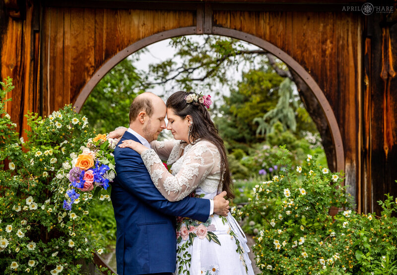Romantic  Wedding Photo in front of the circle gate in the PlantAsia garden at Denver Botanic Gardens