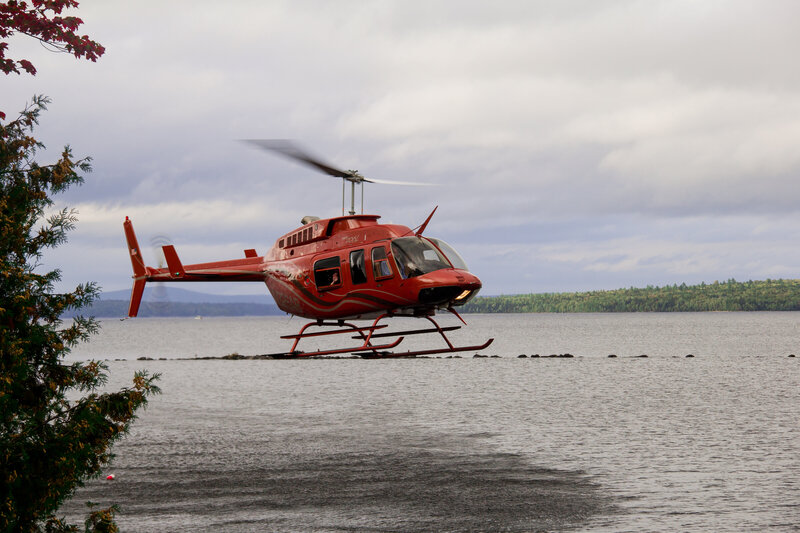 Helicopter taking off with Bride and Groom | Wedding Photography