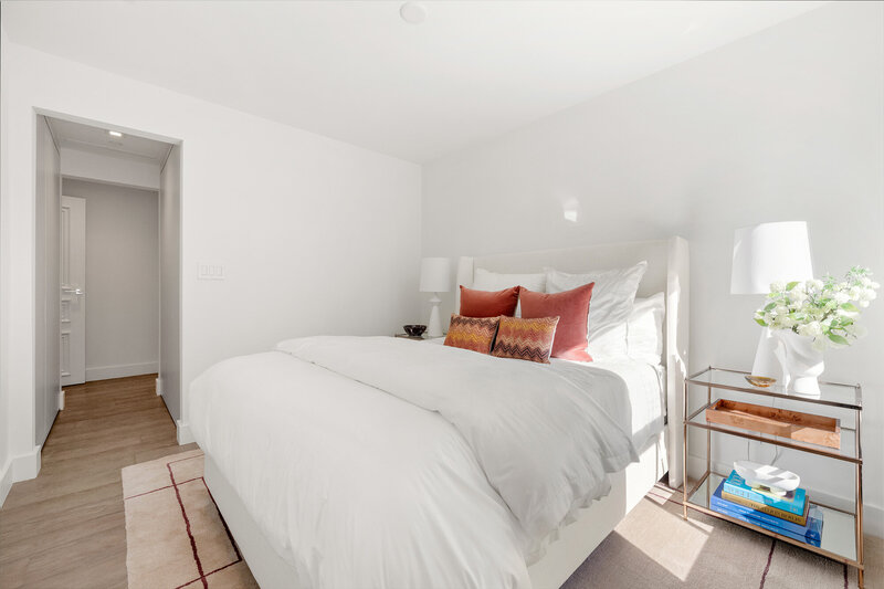 Guest bedroom with Italian closets and oak wood flooring