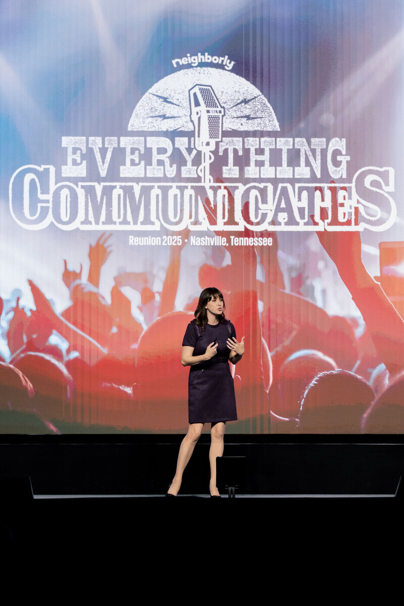 Brittany Hodak delivering a keynote on stage for Neighborly 2025