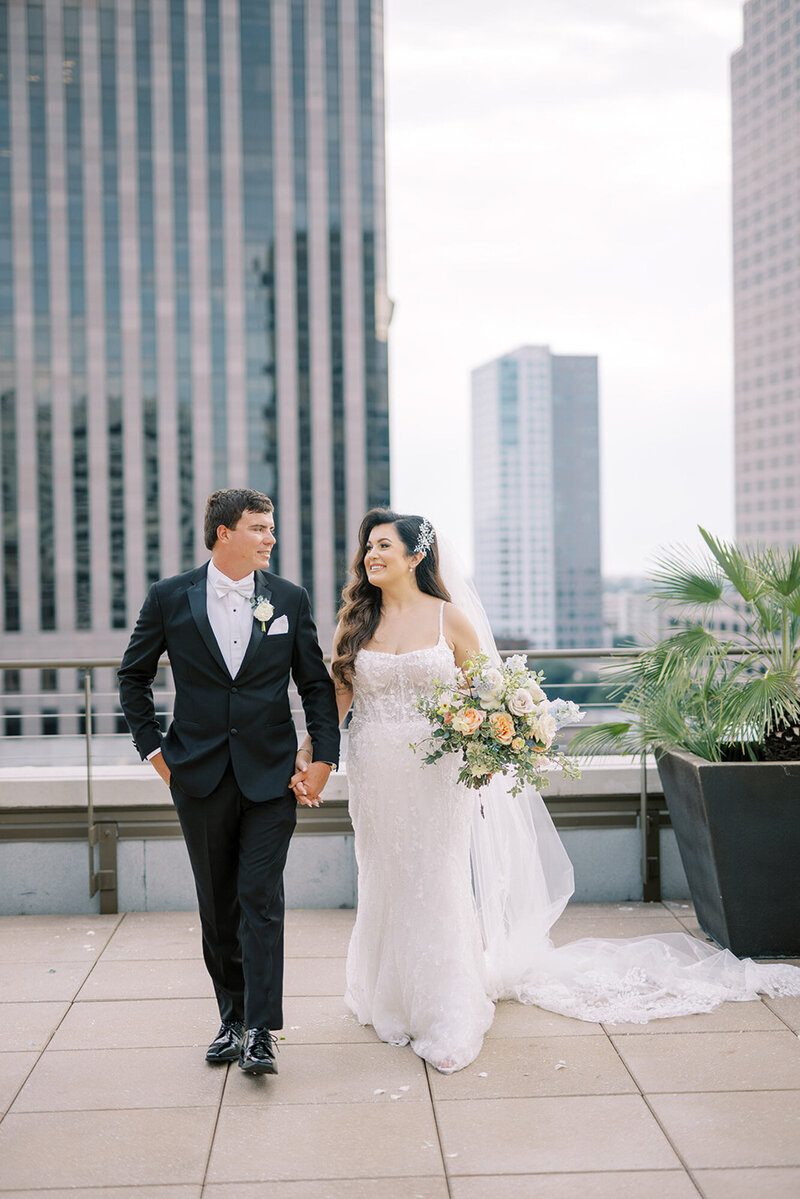 Jenna and Dylan walking on rooftop at the NOPSI hotel