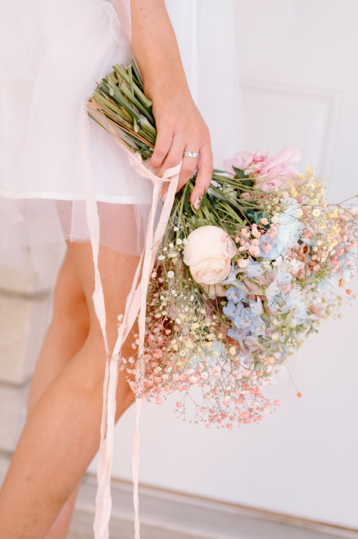 bride holding a flower bouquet