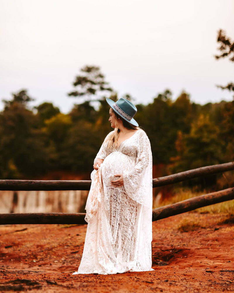 Expecting mother in a beautiful vintage inspired white gown.