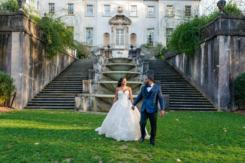 A stunning Black couple gazes lovingly at each other at the iconic Swan House in Historic Atlanta. This romantic moment encapsulates the elegance and timeless beauty of their wedding day.