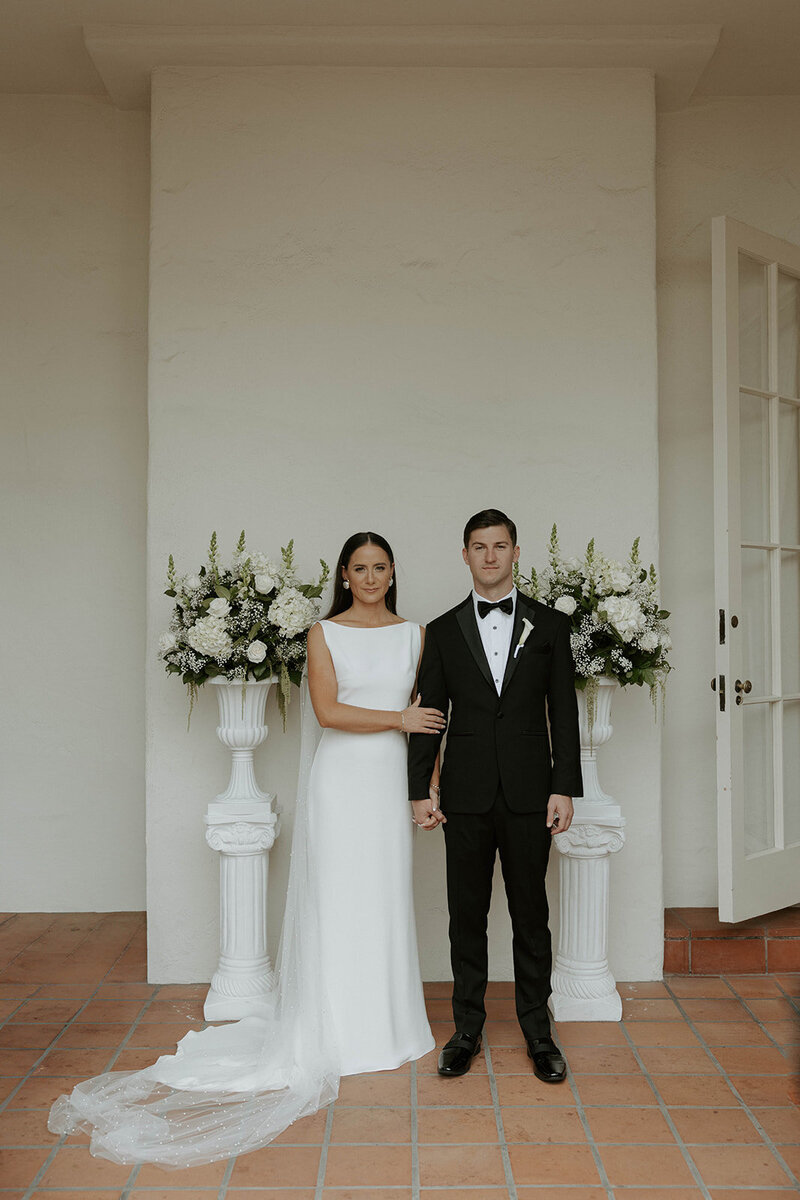 bride and groom posing during elegant wedding in san diego