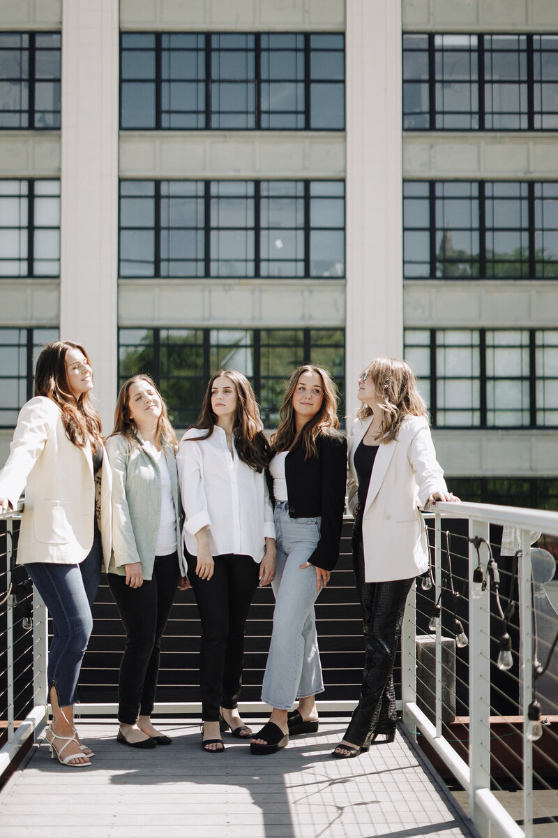 Branding agency team photo of five women dressed in timeless neutrals in Knoxville