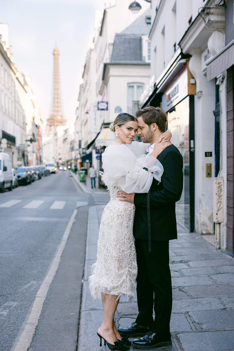 A wedding photo of the couple in the streets of Paris France