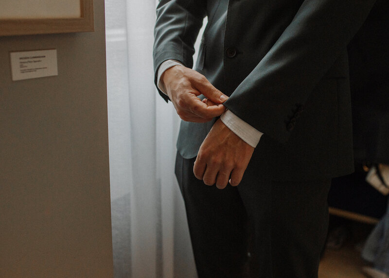 Groom fixing suit sleeve cuff