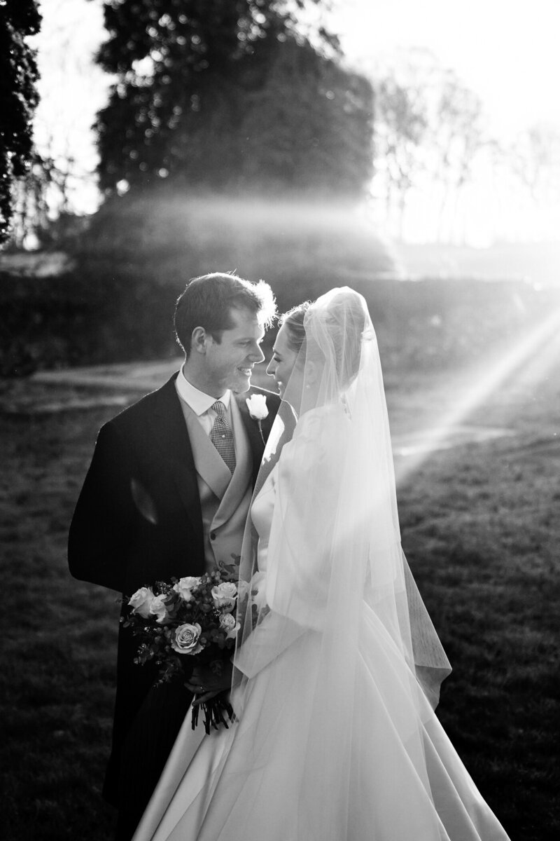 bride and groom together in sunset