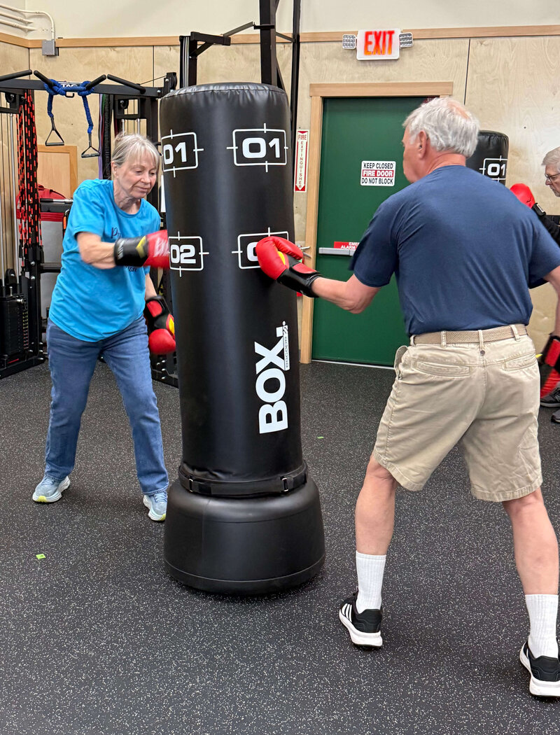 Two Parkinsons warriors complete non-contact boxing exercises, representing how the gym serves as a valuable Oregon Parkinson's resource.  