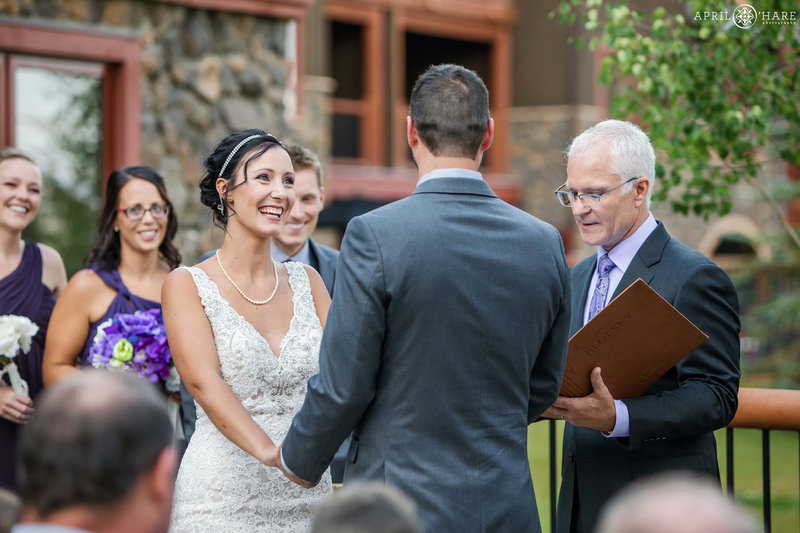 Couple at their outdoor wedding ceremony on the patio at BlueSky Breckenridge