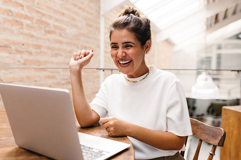 Woman happy at computer