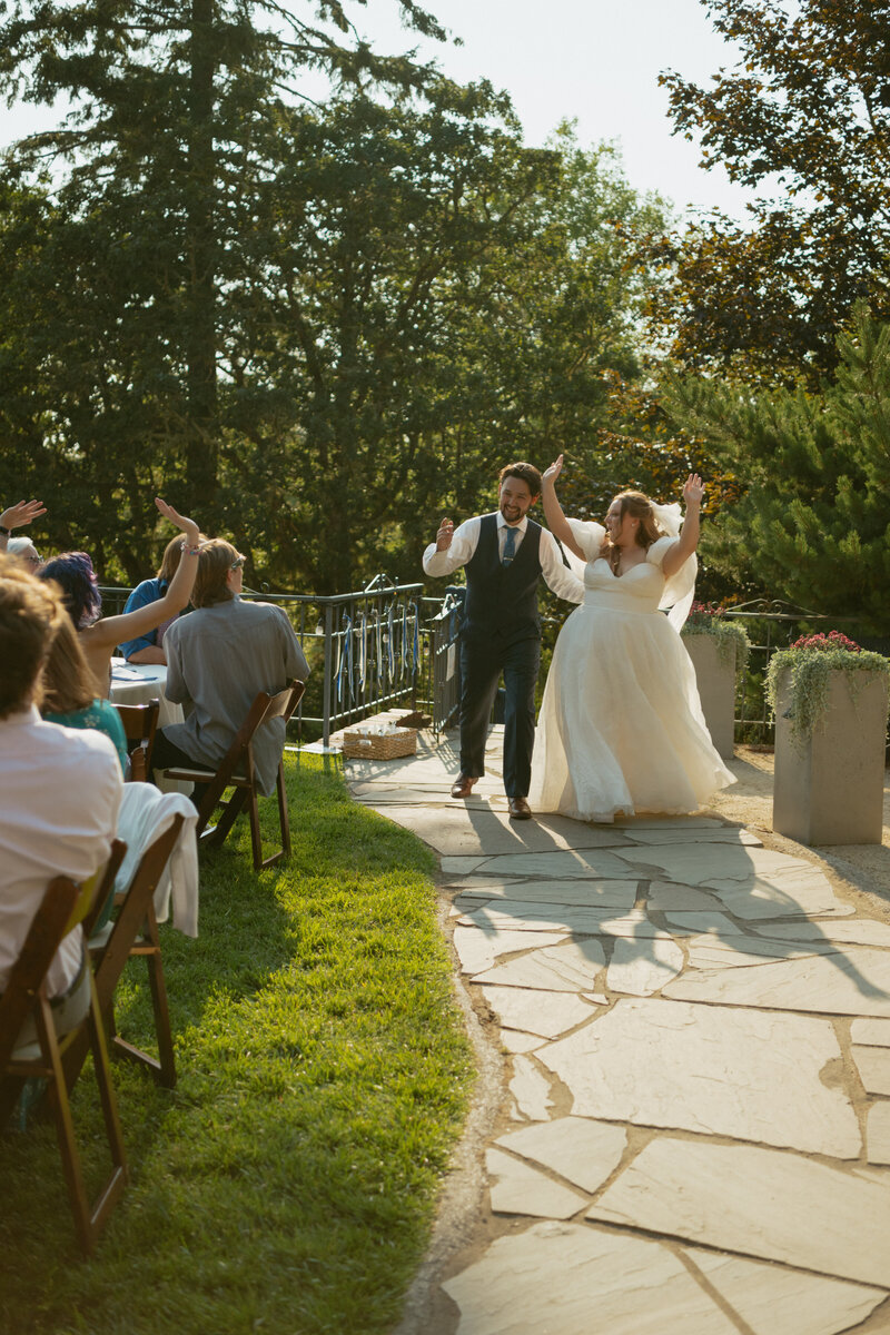 Couple walking into reception at the mount tom house in Oregon 