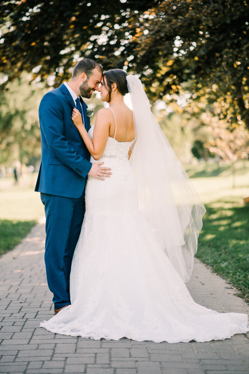 Bride and groom embrace at their wedding in Allentown.