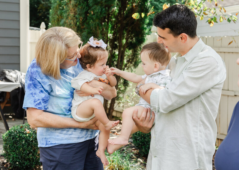 Babies playing at a family celebration
