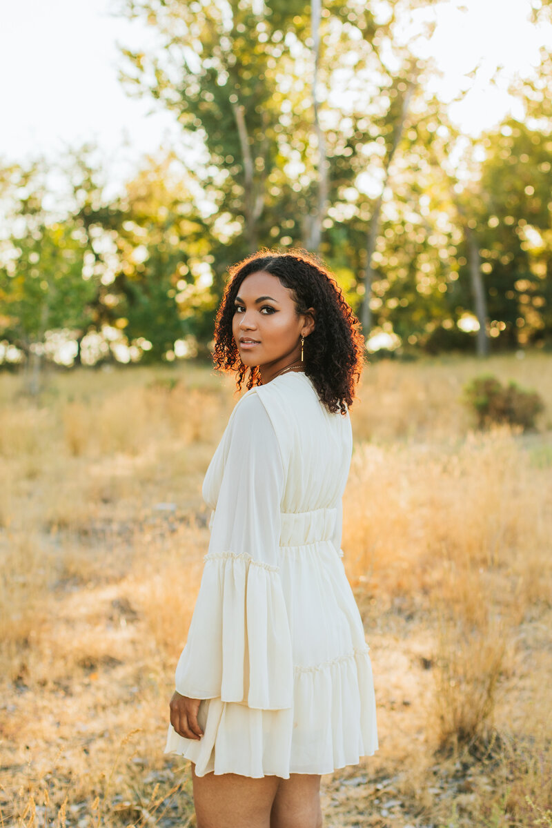 senior girl in dress outdoor graduation shoot