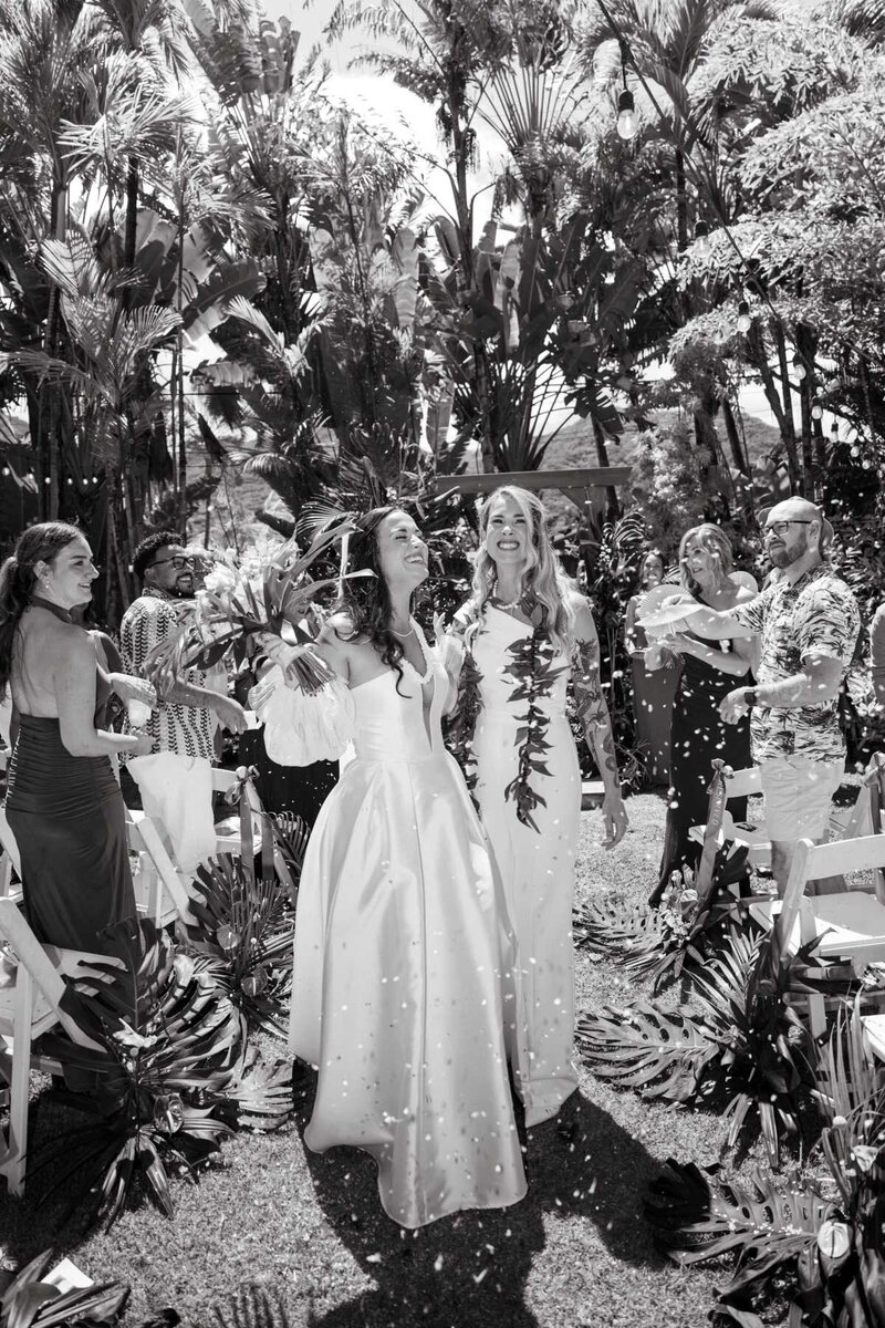 Candid wedding photo of couple’s laughter captured by Oahu photographer