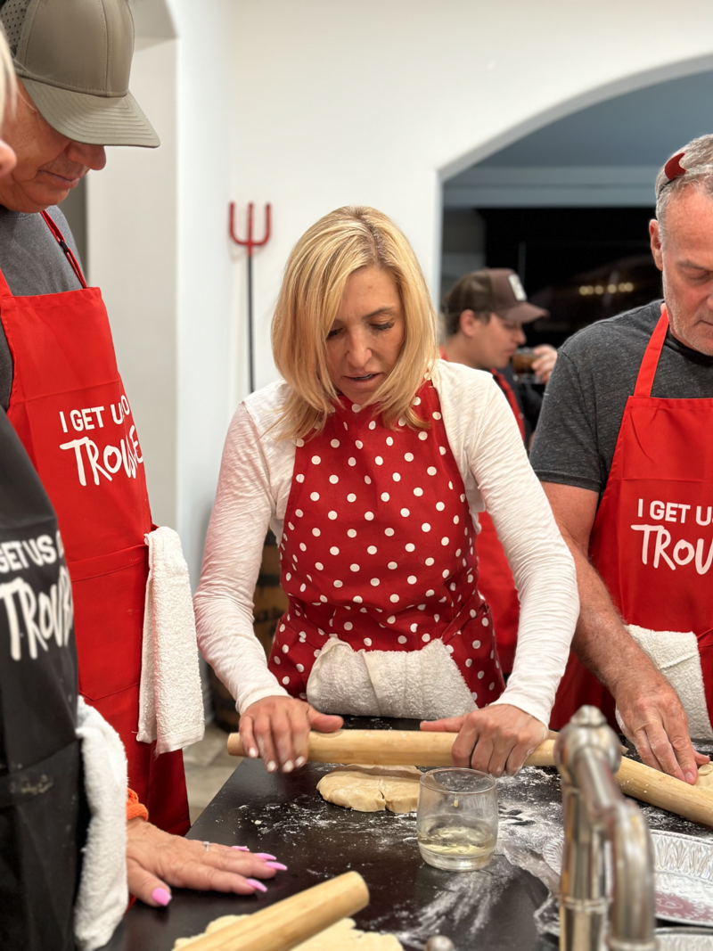 traveling tarts host teaching guests how to roll dough