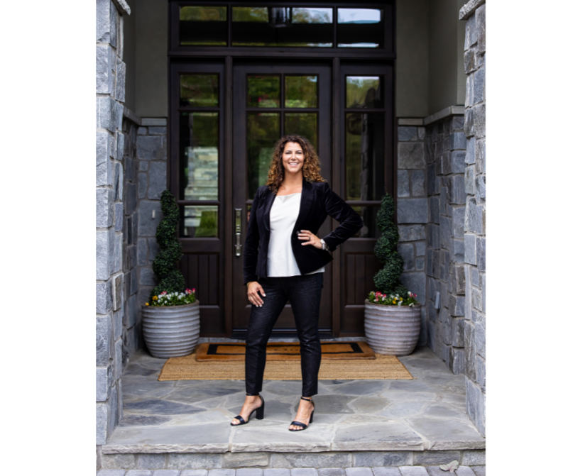 Standing in front of house