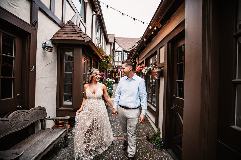 Just married couple walking hand-in-hand through a charming alleyway in San Francisco, captured by San Francisco elopement photographer Kristin Smith.