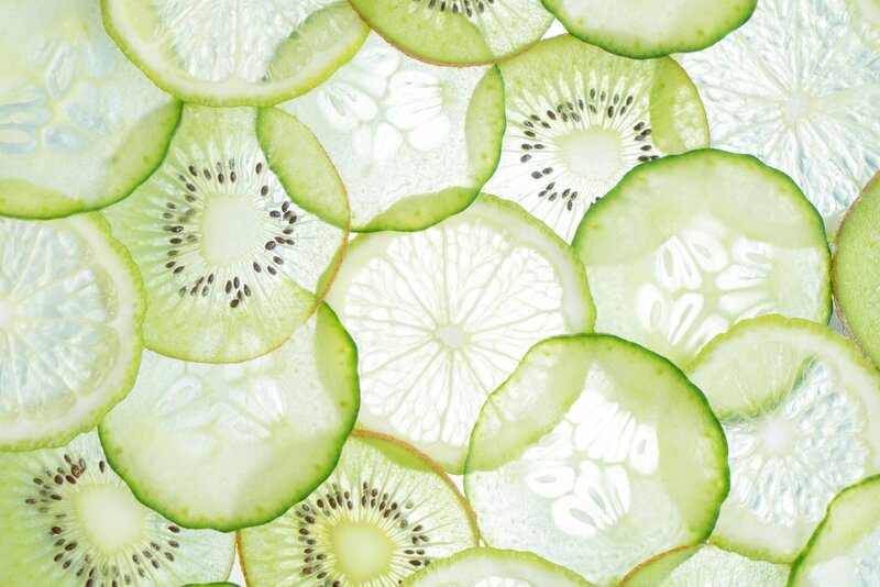 Thinly sliced kiwi cucumber limes layered over each other to create repeat pattern