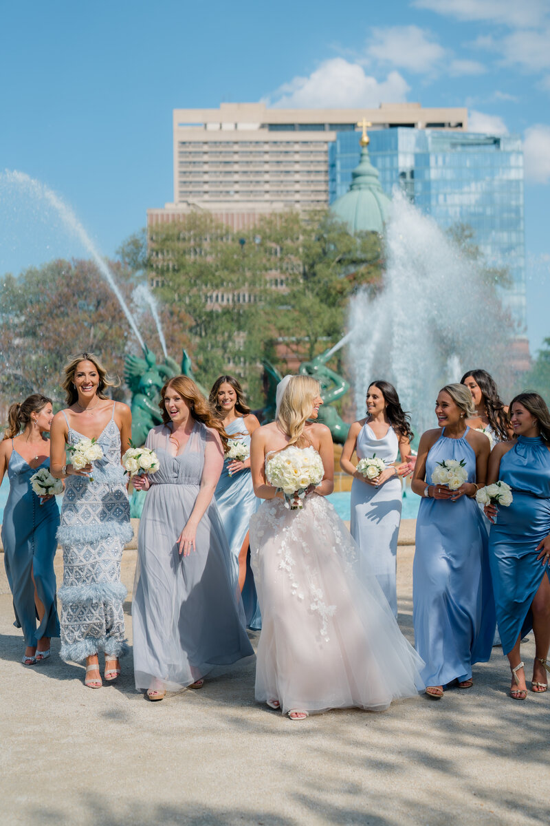 A wedding party walks and laughs together in New Jersey