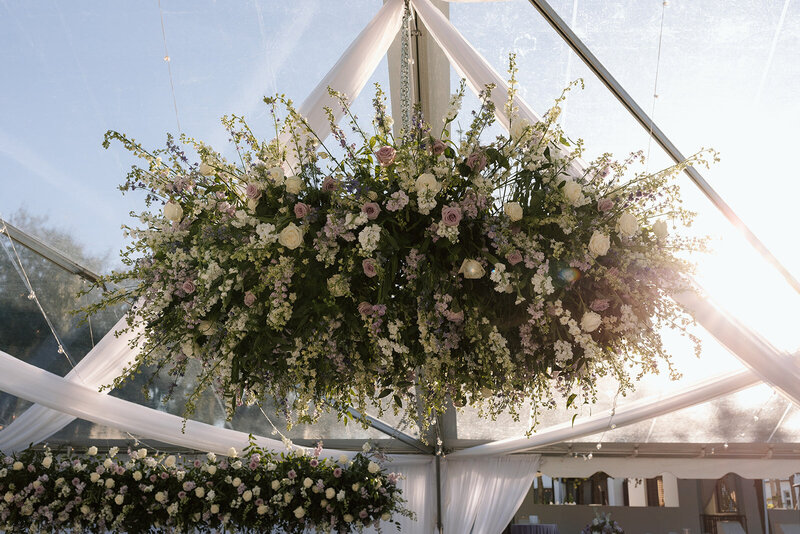 Hanging floral display in tented reception