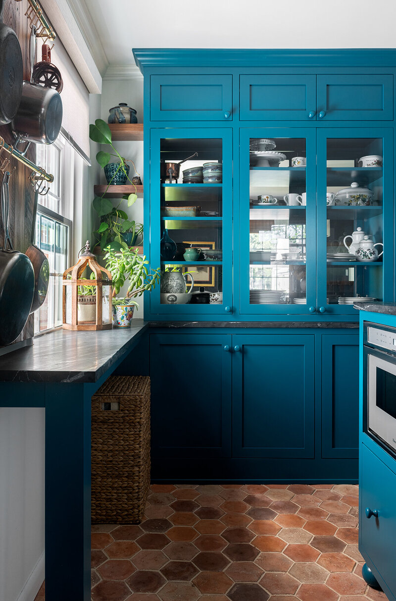 teal blue kitchen with terracotta tile