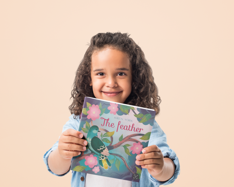 Little girl holding children's book