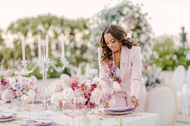 Destination wedding planner at B Astonished events sets a table at Stone Mountain Estate in California.