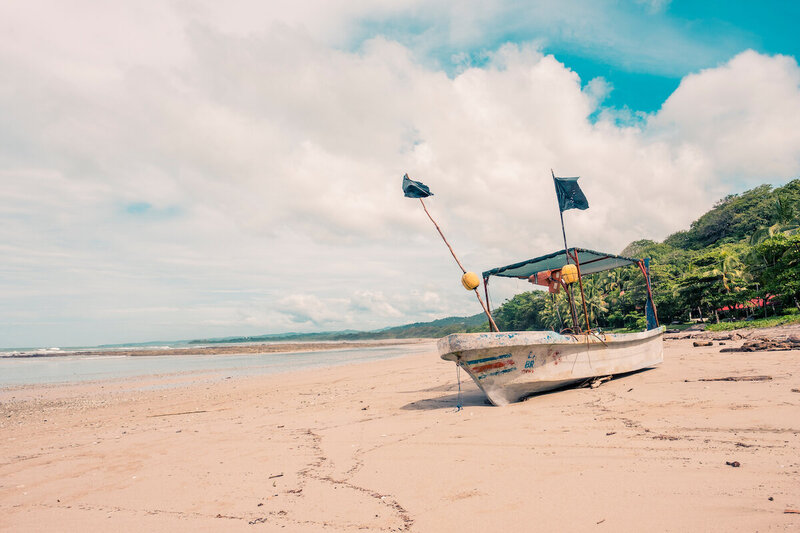 boat on beach blue spirit costa rica