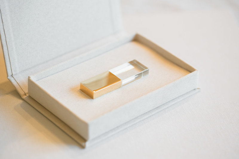 These gold and glass USB's are the perfect storage for your wedding day memories. Photo by Rebecca Cerasani.