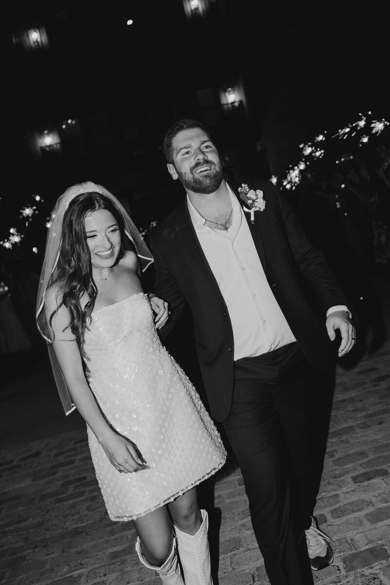 Bride and groom exit their wedding reception
