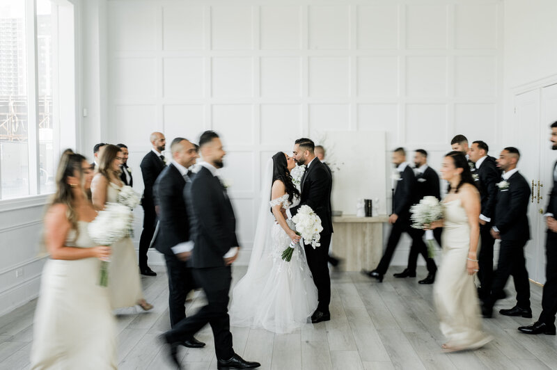 bride and groom cross Toronto street together