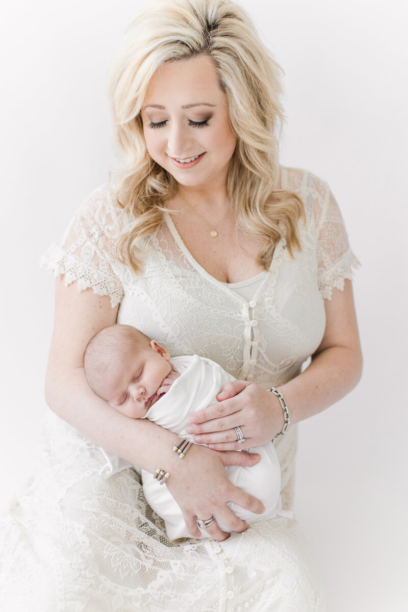 Mom with newborn in our light and airy studio