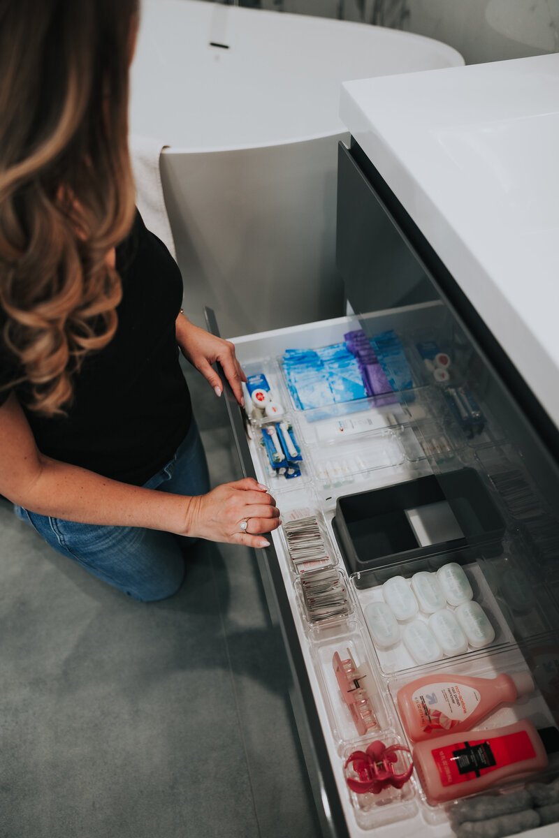 curated closet design with drawers and shelving
