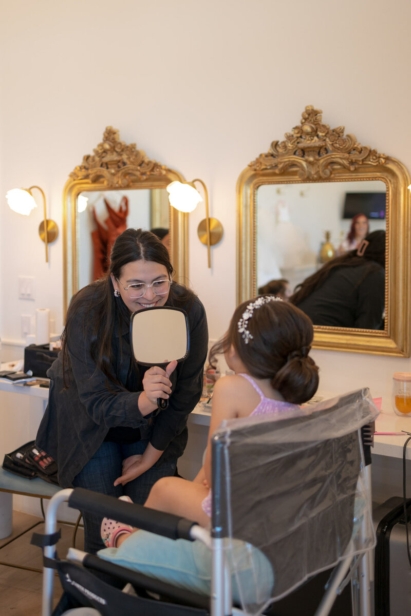 flower girl getting hair done