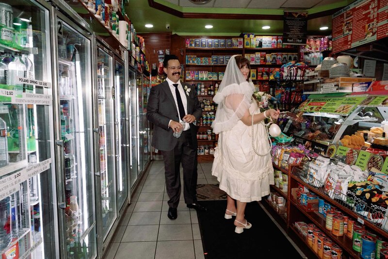 brooklyn cobble hill wedding couple at bodega buying drinks