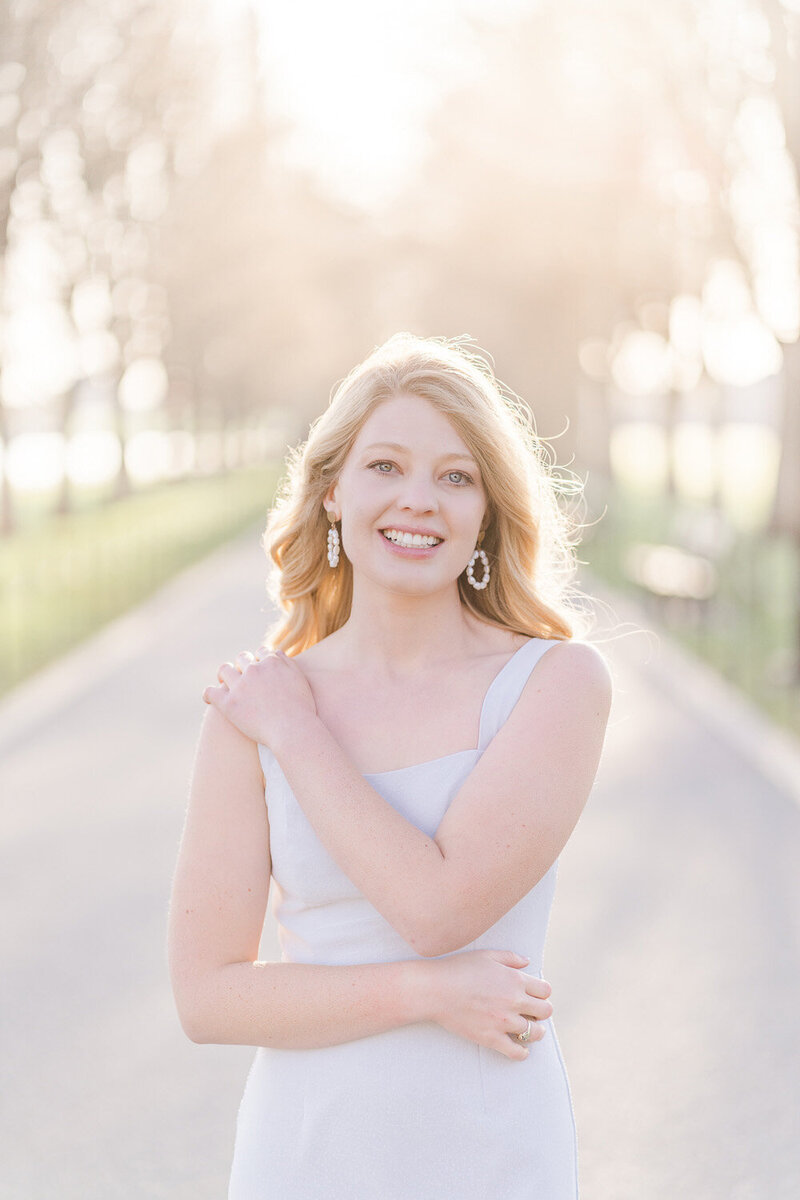 college girl doing senior photos at the park near Lincoln Memorial