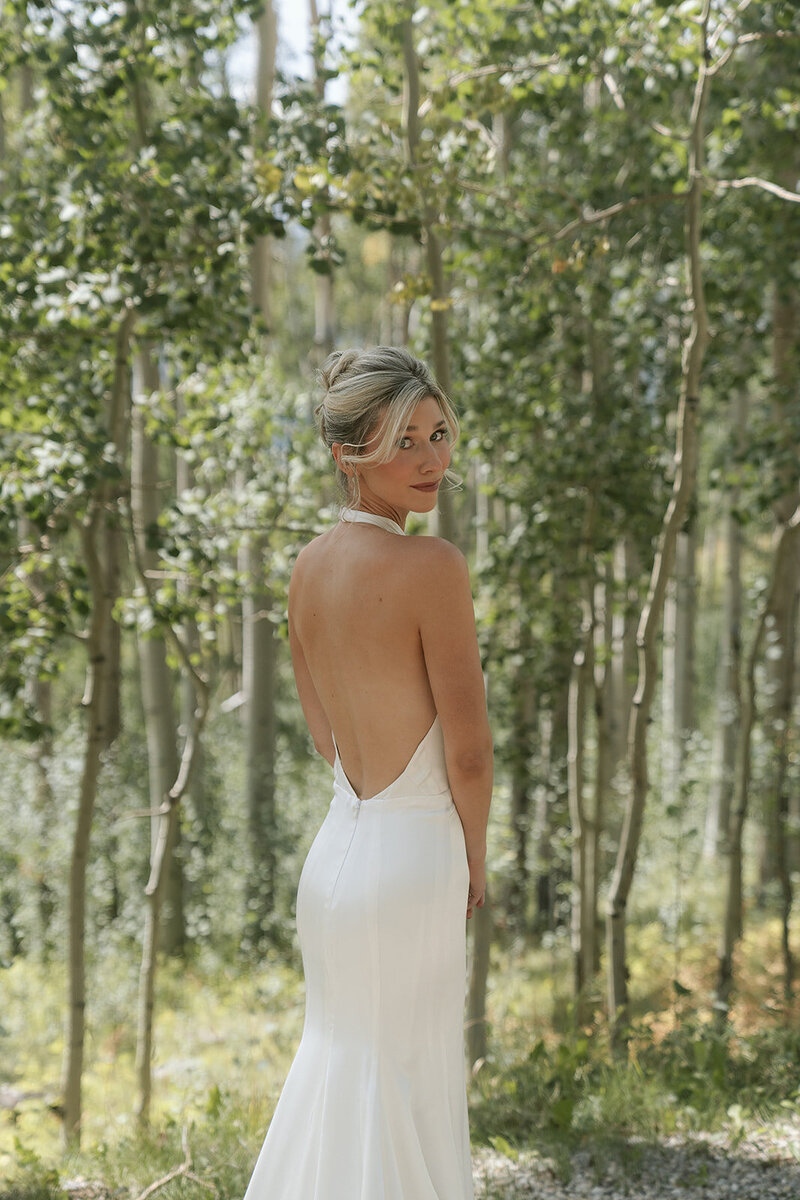 Bride posing in aspen grove