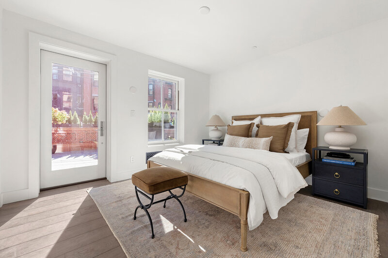 Guest bedroom with oak wood flooring and italian closets