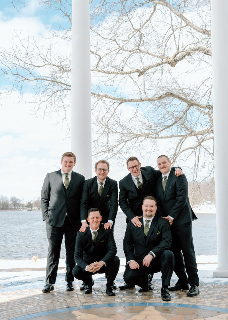 groom and groomsmen in black suits